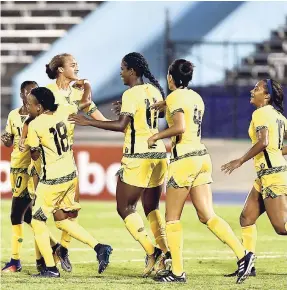  ??  ?? Jamaica’s Reggae Girlz celebrate a goal during their 4-1 win over Trinidad and Tobago at the Concacaf Caribbean Women’s Qualifiers at the National Stadium last August.