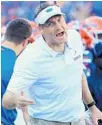  ?? SAM GREENWOOD/GETTY ?? UF coach Dan Mullen speaks to an official during Saturday’s win over LSU.