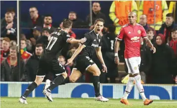  ??  ?? Wissam Ben Yedder (centre) reacts after scoring in Manchester on Tuesday