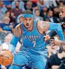  ?? [PHOTO BY BRYAN TERRY, THE OKLAHOMAN] ?? Oklahoma City’s Carmelo Anthony, left, goes past Cleveland’s LeBron James during a Feb. 13 game at Chesapeake Energy Arena.