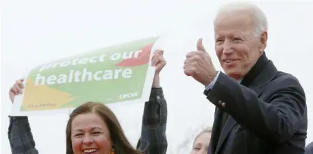  ?? ANGELA ROWLINGS / HERALD STAFF FILE ?? CLOSE TO HOME: Former Vice President Joe Biden gives a thumbs up to the crowd during a rally for striking workers outside the South Bay Stop & Shop, also at left, on April 18. Biden slipped up and called it a Rite-Aid strike on Tuesday.