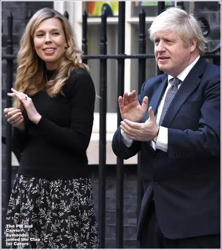  ??  ?? The PM and Carrie Symonds joined the Clap for Carers