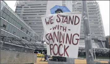  ?? JEFF CHIU / ASSOCIATED PRESS ?? Opponents of the Dakota Access oil pipeline protest at the San Francisco Federal Building on Wednesday. The Army gave a green light Wednesday to the final stage of the $3.8 billion project, which could be completed in three months.