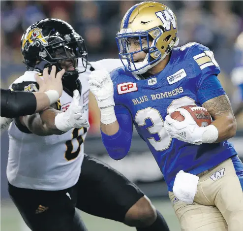  ?? JOHN WOODS / THE CANADIAN PRESS ?? Winnipeg running back Andrew Harris needs 181 yards rushing and 217 receiving yards to become the first CFL player to record 1,000 yards rushing and receiving in the same season.