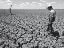  ?? Associated Press file photo ?? Scientists have warned that climate change could bring harsh droughts and other extreme weather, but people are slow to respond — until the bill comes due. That’s human nature.