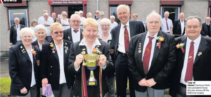  ??  ?? Cup of cheer Overtoun Park’s new president Anna McLean shows off the Reformer trophy