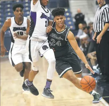  ?? Larry Roberts/Post-Gazette ?? Allderdice’s Tyler Williams, right, drives down the edge of the court while evading Obama’s Derek Gordon in the City League championsh­ip Sunday at Petersen Events Center.