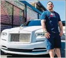  ?? GETTY IMAGES ?? On a Roller: Ruiz and wife Julie parade his belts in a Rolls Bentley and (above and below) he poses in front of his luxury cars
