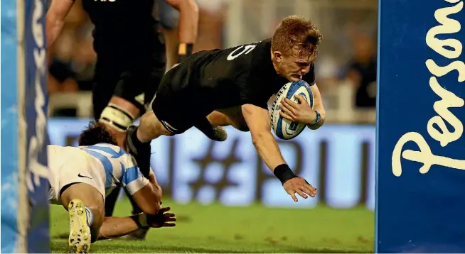  ?? PHOTO: REUTERS ?? Fullback Damian McKenzie dives over to score for the All Blacks during their impressive first half against Argentina. The second 40 minutes were much less memorable.