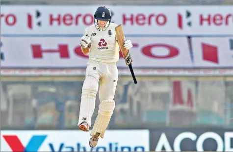  ?? BCCI ?? England skipper Joe Root celebrates after scoring a century on day one of the first Test against India in Chennai on Friday.