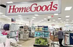  ??  ?? In this May 16, 2017 photo, a shopper pushes a cart inside a HomeGoods store, in Salem, N.H. Yesterday, the Commerce Department released retail sales data for July. — AP