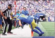  ?? Rich Schultz / Getty Images ?? The Rams’ Cooper Kupp catches a touchdown pass against the Giants in the second quarter at on Sunday in East Rutherford, N.J.