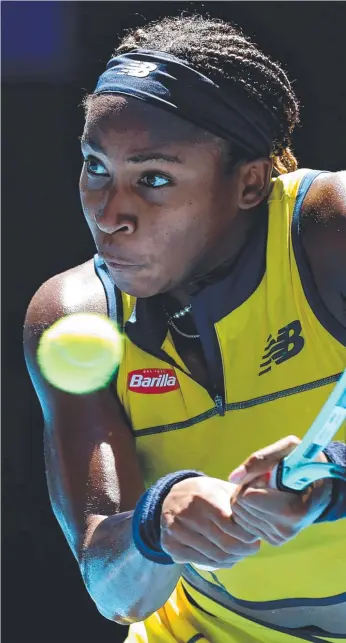  ?? ?? American Coco Gauff unleashes a double-handed backhand against Ukraine’s Marta Kostyuk during their Australian Open quarterfin­al in Melbourne. Picture: Darrian Traynor/Getty Images