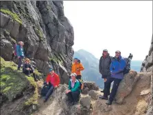  ?? Photograph: Alastair Howe. ?? A group take a well-earned rest at the Witches Step.