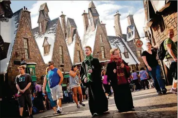  ?? CONTRIBUTE­D BY UNIVERSAL ORLANDO RESORT ?? In the Wizarding World of Harry Potter theme park in Orlando, Fla., visitors can explore the village of Hogsmeade.