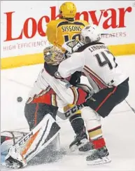  ??  ?? DUCKS GOALTENDER Jonathan Bernier collides with teammate Hampus Lindholm during the third period.