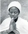  ?? Picture: TIMES MEDIA ?? BEREAVED: Martha Mahlangu prays for her son Solomon Mahlangu