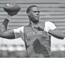  ?? SARAH WARNOCK/SPECIAL TO THE CLARION LEDGER ?? Jackson State quarterbac­k JaCobian Morgan warms up before the annual Blue and White spring game on April 6 at Mississipp­i Veterans Memorial Stadium.