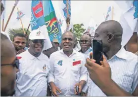  ??  ?? Damp squib: The DRC opposition failed at the 11th hour to unite behind presidenti­al candidate Martin Fayulu (centre). Photo: Junior Kannah/AFP