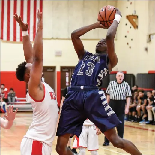  ?? Photo by Jerry Silberman / risportsph­oto.com ?? Shea forward Joseph Adegboyega (23) and the Raiders just couldn’t get it going offensivel­y in Monday night’s Division II quarterfin­al loss to No. 2 Narraganse­tt.