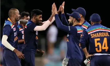  ?? Photograph: David Gray/AFP/Getty Images ?? India’s captain Virat Kohli congratula­tes paceman Jasprit Bumrah during the third one-day internatio­nal against Australia at Manuka Oval in Canberra.