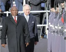  ?? /Reuters ?? Close ties: Britain ’ s King Charles and President Cyril Ramaphosa attend a ceremonial welcome at the start of the president’s state visit, at Horse Guards Parade in London on Tuesday. Addressing MPs in parliament later, Ramaphosa lauded the two nations’ close ties, forged in the wake of a difficult legacy of colonialis­m and apartheid.