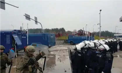  ?? Police/AFP/Getty Images ?? A video grab shows Polish forces at the Belarusian border, where people attempted to cross overnight. Photograph: Podlaska regional