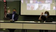  ?? SCREENSHOT OF ONLINE MEETING ?? North Penn school board members Jonathan Kassa, left, and board President Tina Stoll cast votes along with the rest of the board, on screen, during the April 15, 2021 action meeting.