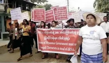  ?? PICTURE: AP ?? Protesters march in Sittwe, Myanmar, yesterday. Hundreds of hard-line Buddhists protested to urge Myanmar’s government not to repatriate the nearly 600 000 minority Rohingya Muslims who have fled to Bangladesh since late August to escape violence in...