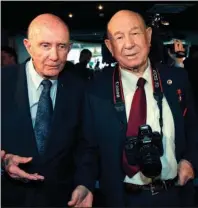  ?? The Associated Press ?? ALEXEI LEONOV: In this April 11, 2011, file photo, retired NASA astronaut Thomas Stafford, left, and retired Russian cosmonaut Alexei Leonov visit an exhibition dedicated to the 50th anniversar­y of the first man in space in Moscow, Russia. Leonov, the first human to walk in space, died in Moscow on Friday. He was 85.