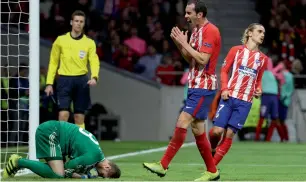  ?? Reuters ?? Atletico Madrid’s players react during the Champions League match against Qarabag. —