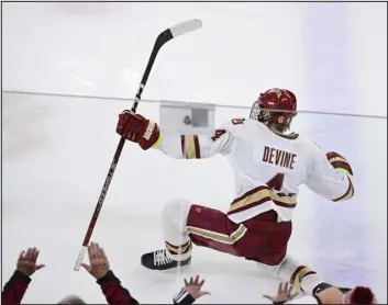  ?? ANDY CROSS — THE DENVER POST ?? Denver forward Jack Devine celebrates his game-winning overtime goal against Providence in 2022. Now a junior, Devine leads the nation with 21 goals as a key part of DU’S top-ranked offense.