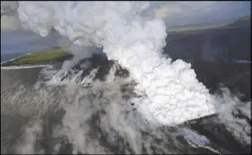  ?? AP PHOTO ?? A laze (lava haze) plume rises from the northern side of the fissure 8 lava flow margins in the former Kapoho Bay at the town of Kapoho.