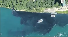  ?? PATRICK J. PROCTOR/RAINBOW AIR INC., VIA AP ?? In this July 29 photo, black-coloured wastewater treatment discharge is released into water below the falls, in Niagara Falls, N.Y., before tourists' eyes on Saturday.