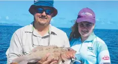  ??  ?? BOUNTY: Danielle was excited to catch her first coral trout, fishing with dad Michael and uncle Darryl with Fish Tales Charters.