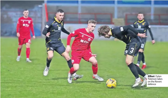  ?? ?? Effort Dylan Paterson takes on the Rovers defence