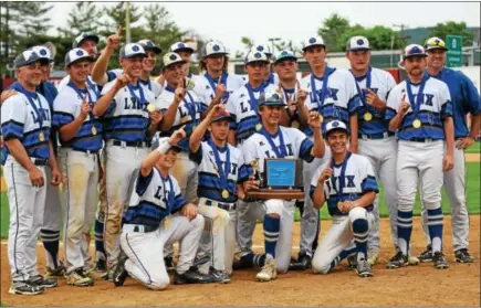  ?? AUSTIN HERTZOG - DIGITAL FIRST MEDIA ?? Oley Valley poses with the Disrtict 3-AA championsh­ip trophy on June 2.