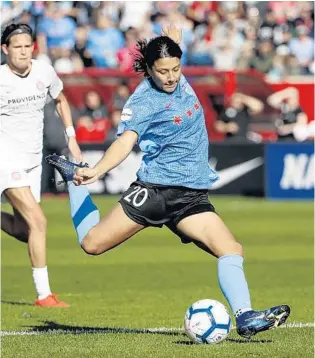  ?? KAMIL KRZACZYNSK­I/AP ?? Chicago Red Stars forward Sam Kerr scores against the Portland Thorns FC on Oct. 20.