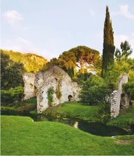  ??  ?? Lelia and Hubert Howard’s garden at Ninfa, showing the medieval ruins, lawn and trout stream in the foreground