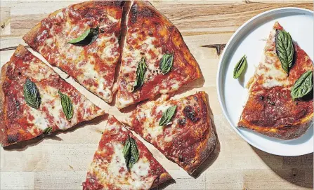  ?? TOM MCCORKLE FOR THE WASHINGTON POST ?? As long as you are OK with not expecting to re-create the pies you might find coming out of a wood-burning Neapolitan oven, you can make good pizza at home with normal home kitchen equipment, even more basic than you might think.