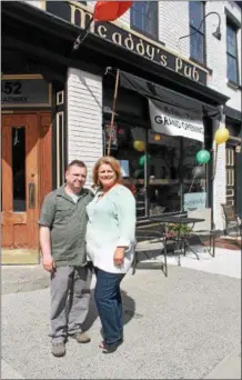  ?? LAUREN HALLIGAN — LHALLIGAN@DIGITALFIR­STMEDIA.COM ?? Owner Susie Carrk stands with her husband Gerard Lauria outside the new McAddy’s Pub on Broadway in downtown Troy.