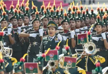  ?? ERANGA JAYAWARDEN­A/AP ?? Soldiers of the Sri Lankan army’s Women’s Corps march Saturday in Colombo to mark the effectivel­y bankrupt nation’s 75th year of independen­ce from British colonial rule. The force was establishe­d in 1979 with the assistance of Britain’s Women’s Royal Army Corps, after which it was modeled. Today, Sri Lanka’s total foreign debt exceeds $51 billion.