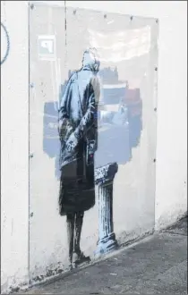  ?? Picture: Alan Langley FM4465167/ Picture: Wayne McCabe FM3430496 ?? Two men have been arrested on suspicion of theft after this Banksy-style painting appeared on hoardings; the genuine Banksy at Payers Park