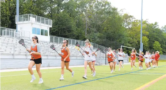  ?? PAUL W. GILLESPIE/CAPITAL GAZETTE ?? Chesapeake Club Lacrosse held a skills session at Annapolis High School in June. Anne Arundel County recreation­al sports are in full bloom, one year after the pandemic wiped out spring activities.