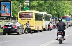  ?? HONG MENEA ?? Vehicles parked along Sothearos Boulevard in Phnom Penh yesterday. The capital’s Traffic and Public Order Department is launching a crackdown on unlawfully parked cars along busy streets.