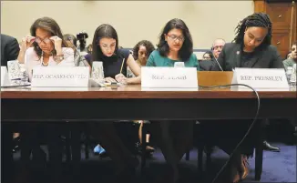  ?? Pablo Martinez Monsivais / Associated Press ?? From left, Rep. Veronica Escobar, DTexas, Rep. Alexandria OcasioCort­ez, DN.Y., Rep. Rashida Tlaib, DMich., and Rep. Ayanna Pressley, DMass., wait to testify before the House Oversight Committee hearing on family separation and detention centers Friday on Capitol Hill in Washington.