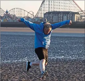  ?? ?? FIGHTING FIT: The PM runs on Blackpool beach before his speech yesterday