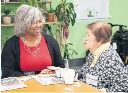  ?? JONATHAN NICHOLLS FOR THE TORONTO STAR ?? Mercedes Watson, CEO of Dixon Hall, left, with Carmen Mendiola, from Dixon Hall’s Adult Day Program — just one of many programs offered at the agency.