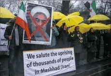  ?? Eddie Keogh/Reuters ?? Opponents of Iranian President Hassan Rouhani protest outside the Iranian embassy in West London.