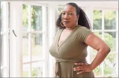  ?? Associated Press ?? Tarana Burke, founder and leader of the #MeToo movement, stands in her home in Baltimore on Oct. 13. Black women and girls are now the focus of several high-profile philanthro­pic initiative­s as major donors look to address the racial wealth gap and the long-chronicled funding disparity for organizati­ons serving minority women.